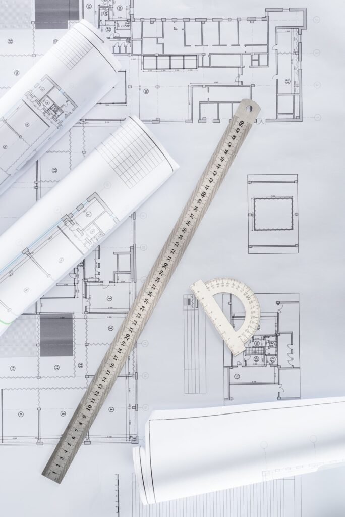 top view of architect blueprints with ruler and protractor
